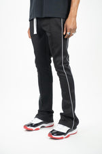 STACKED TRACK PANTS